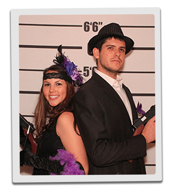 Cincinnati Murder Mystery party guests pose for mugshots