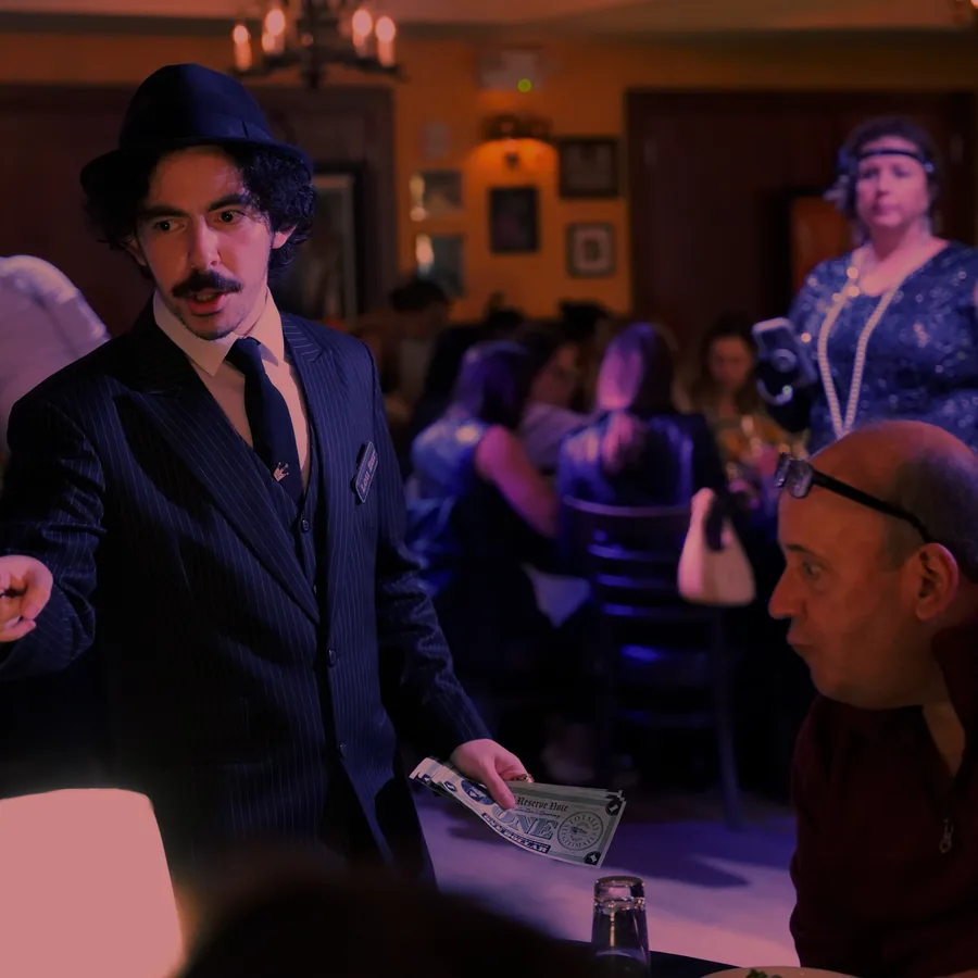 A Murder Mystery Company actor working the room at a Cincinnati show