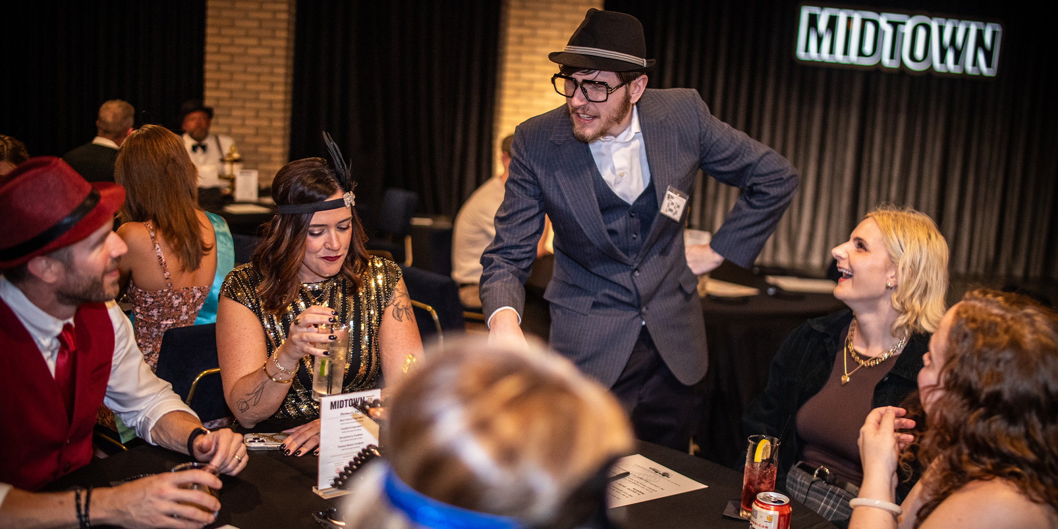 Guests at a Murder Mystery Company public dinner show in Cincinnati